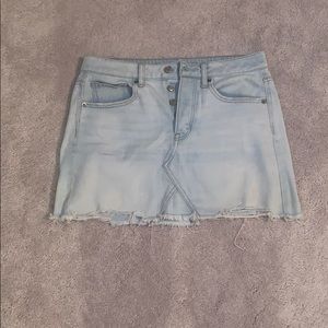 Light wash distressed denim skirt